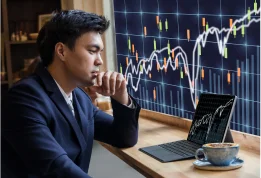 Businessman looking at stocks on his computer