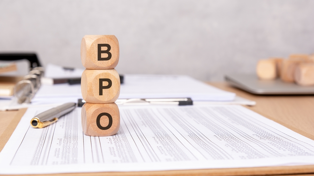 BPO documents and office paperwork illustrating strategies on how to effectively manage BPO processes and compliance.