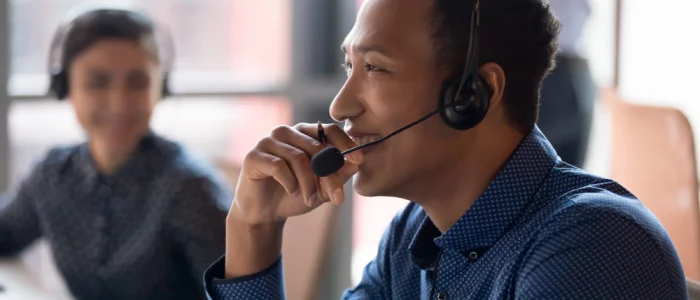 Smiling young businessman call center agent