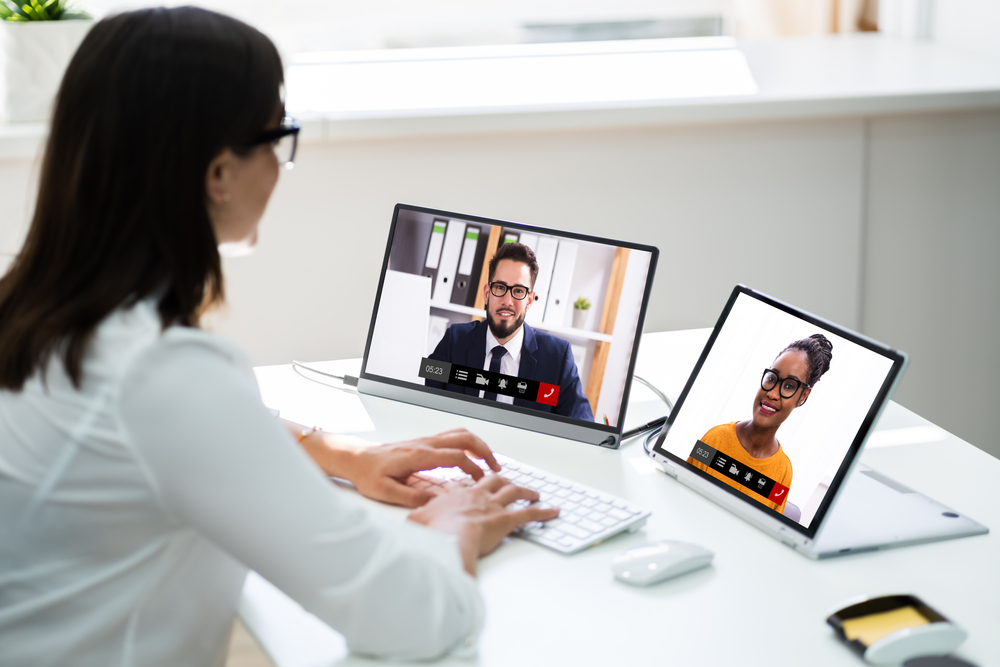woman working from home on video call with colleagues