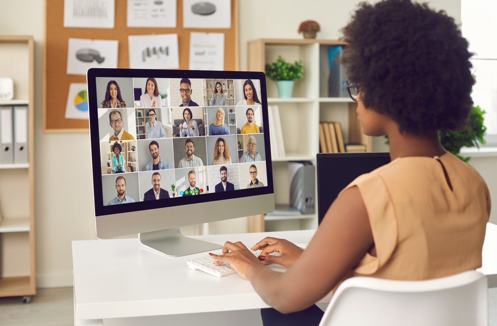 woman on computer during video call with colleagues