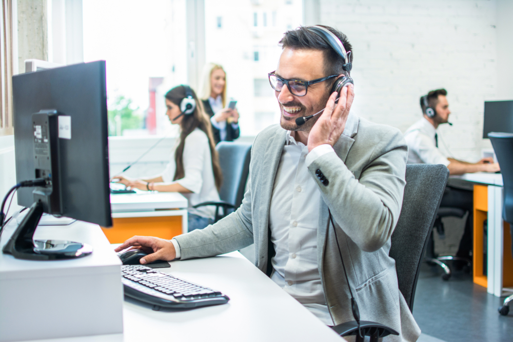 customer service agent smiling on the phone