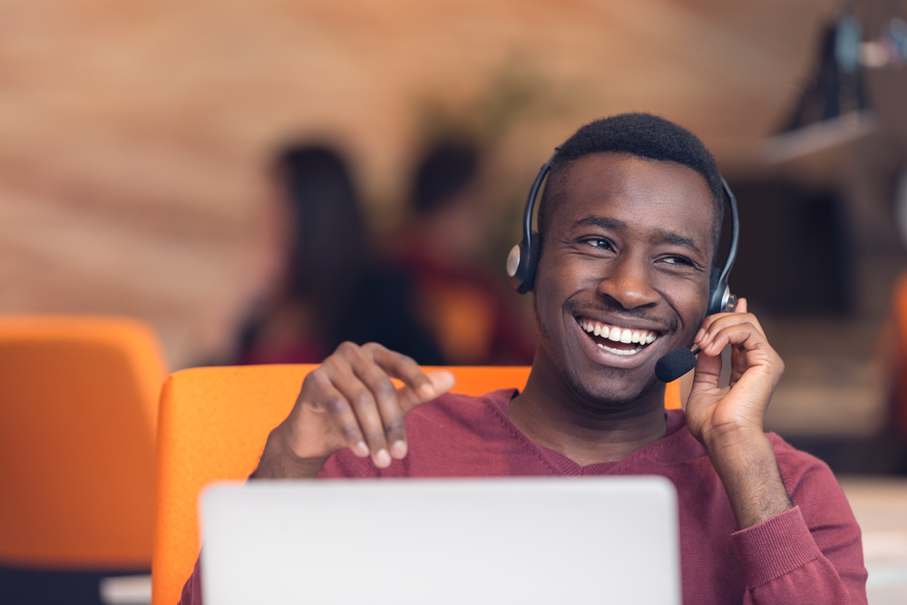 call center agent smiling with headset on