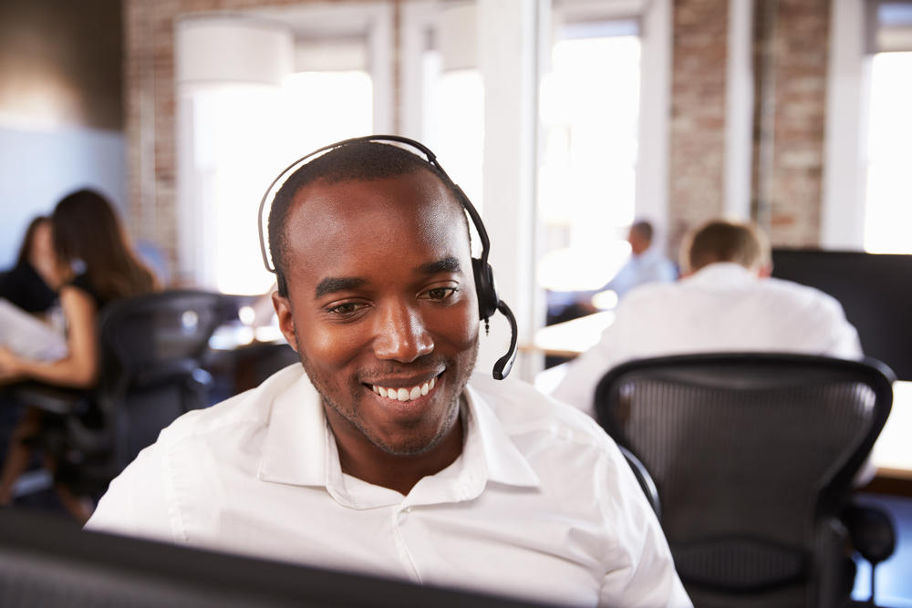 call center agent smiling while on the phone