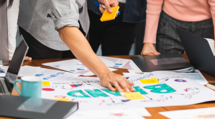 marketing team looking over papers during meeting