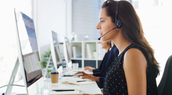 Call center, computer screen and woman consulting with headset for inbound query, technical support and advice. Contact us, consultant and reading FAQ for help desk assistance and troubleshooting.