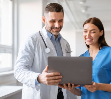 Doctor smiling with nurse