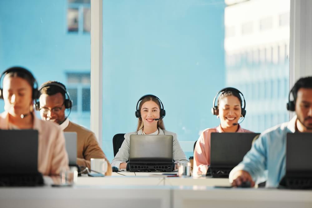 Group of call center agents work on an insurance company's back office and claims processing.