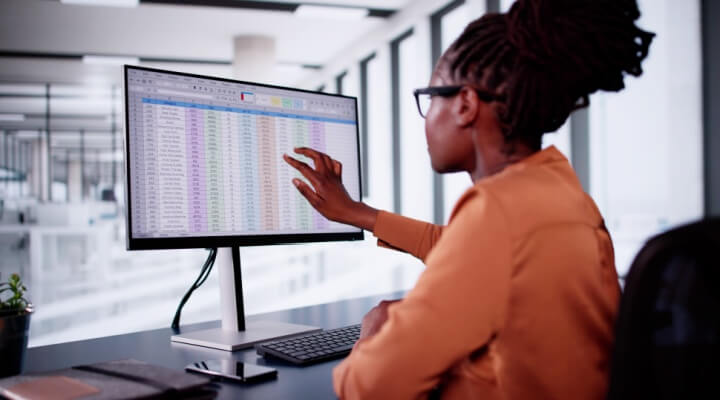 Professional call center agent enters medical billing codes into claims.