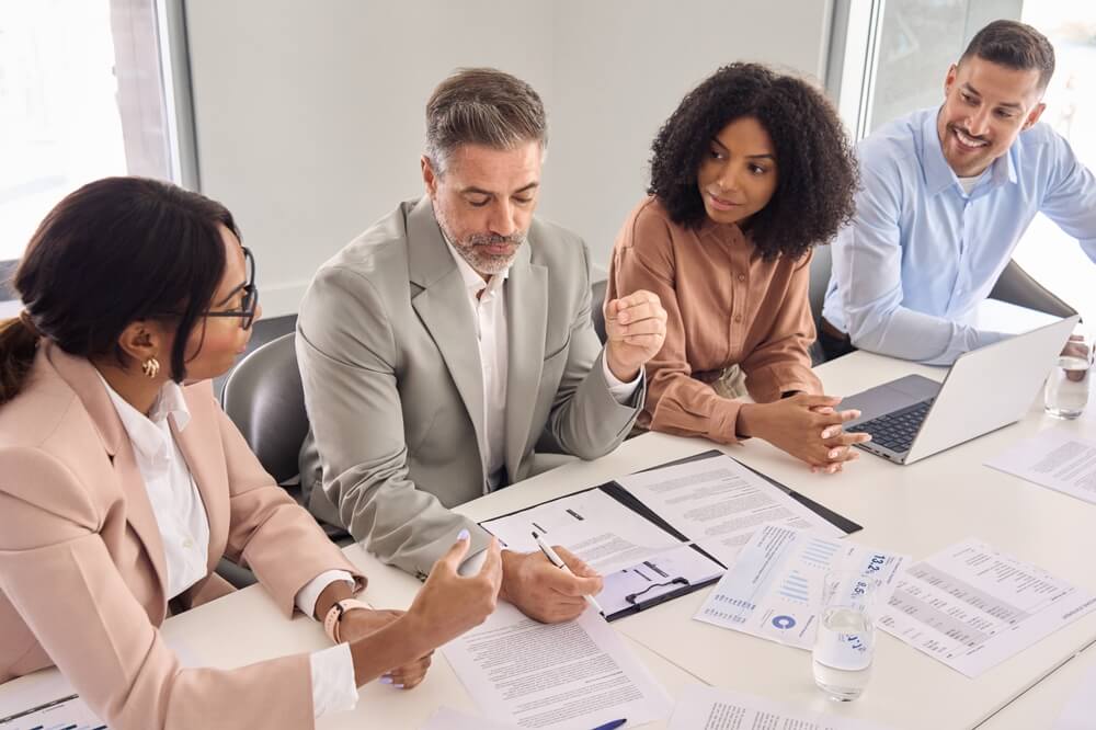 BPO leadership goes over compliance and risk management strategies for an insurance company customer.