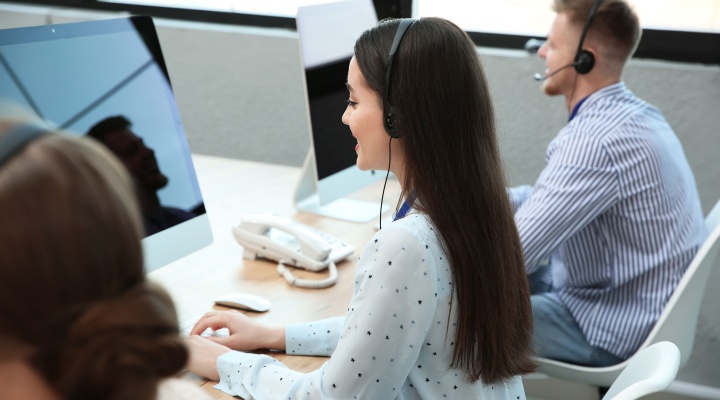 Call center agents working with colleagues in BPO call center, using BPO strategy for business growth, nearshoring and onshoring BPO.