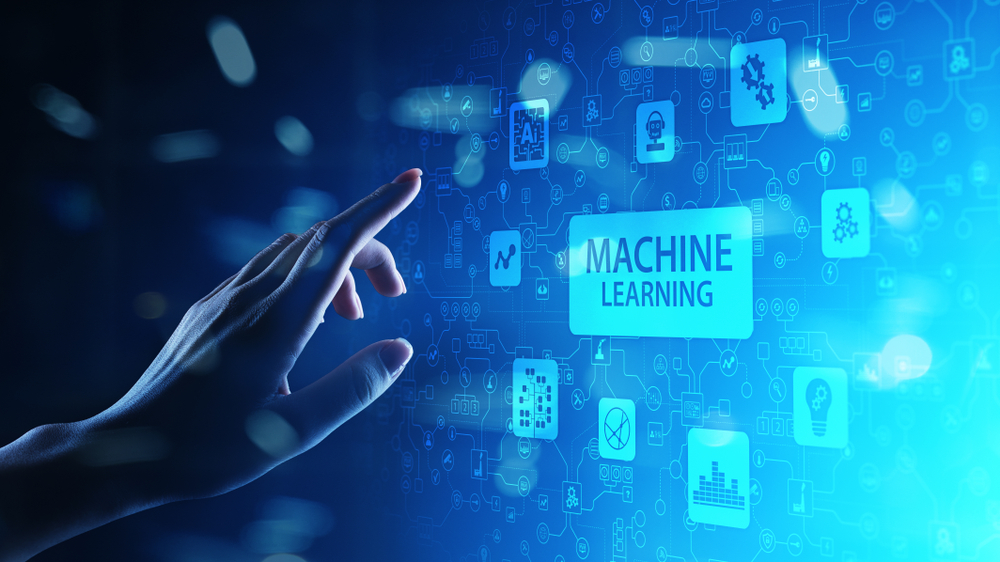 Hand touching a virtual machine learning interface, representing how AI and automation influence current outsourcing trends and digital transformation.