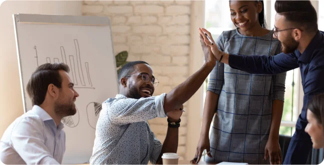 Coworkers shaking hands in an office