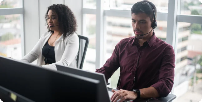 Men and women working in call center