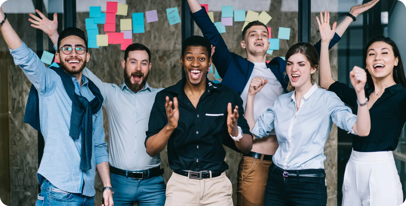 A group of people celebrating in an office