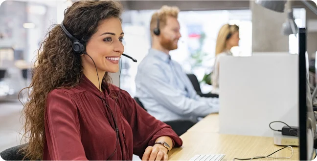 Happy woman working in call center office