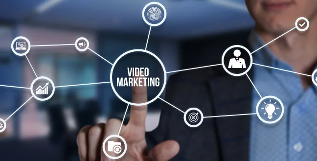 Businessman pointing a digital video marketing icons.