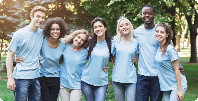 Youngers at a park with blue T-shirts