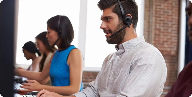 Side view of four contact center agents